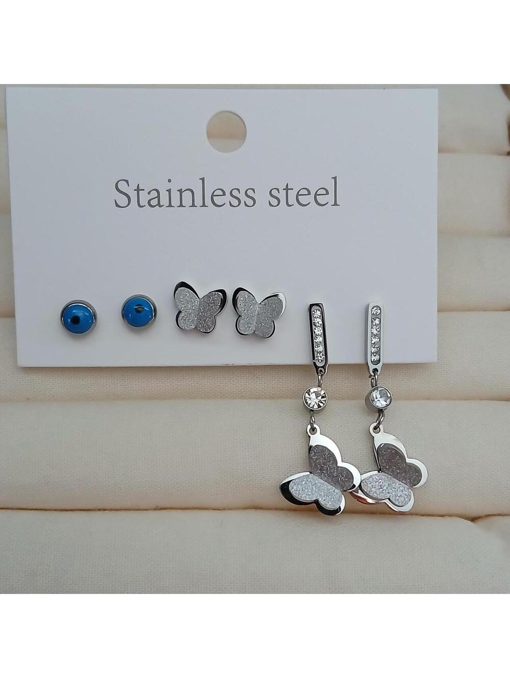 Silver butterfly earrings with rhinestone accents #butterfly # rhinestones